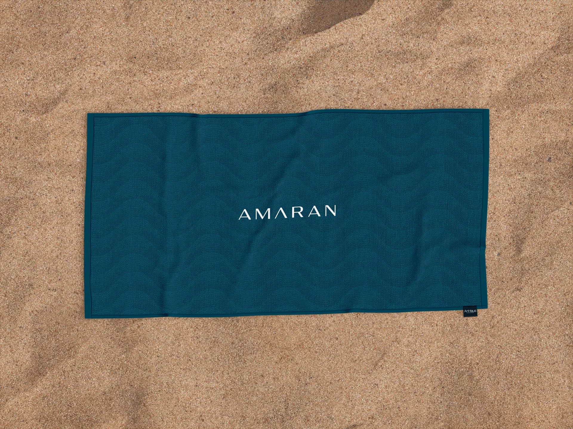 Amaran, Toalha de praia com identidade visual