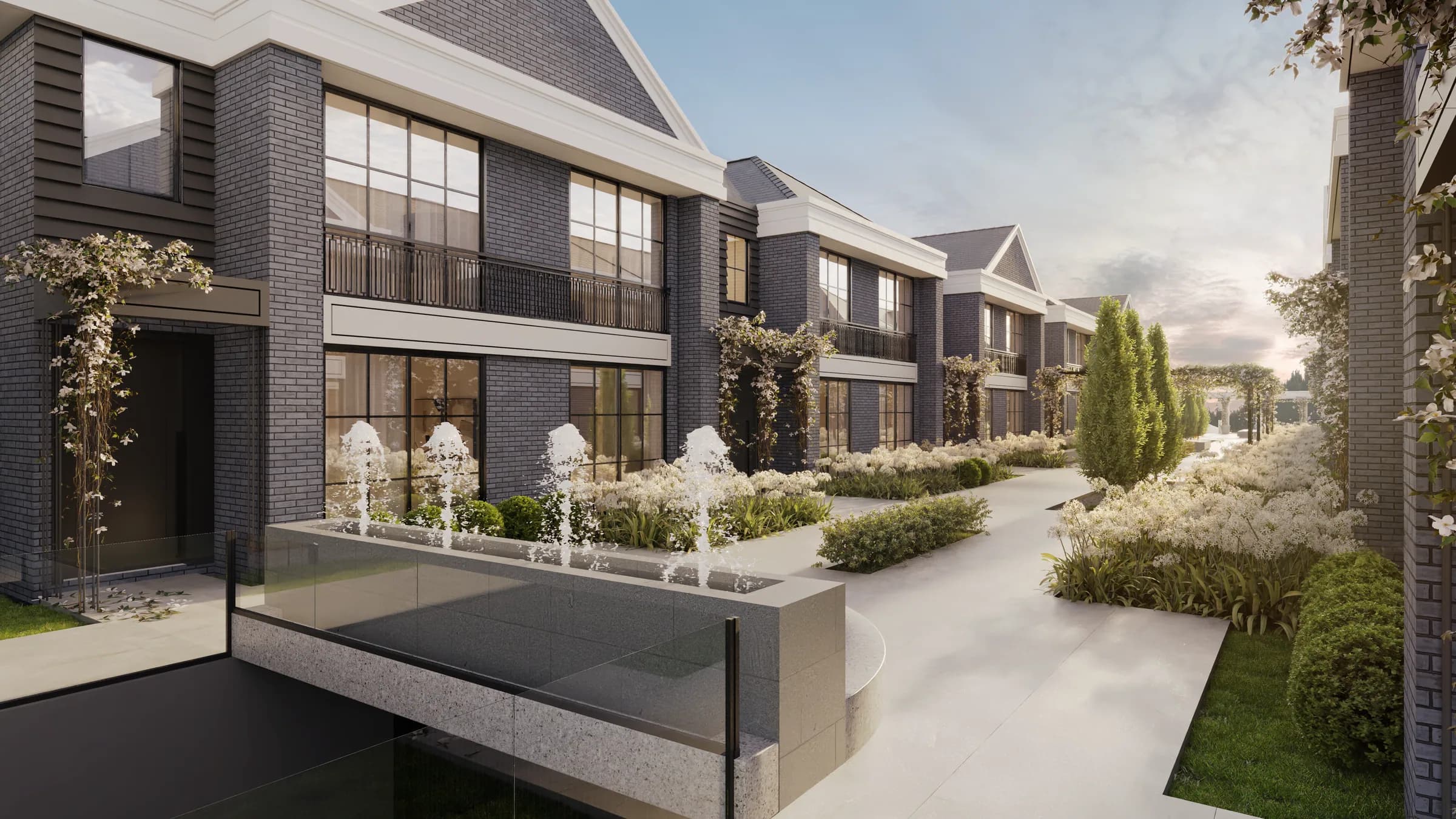 Galliano 250, boulevard entre as casas com espelho d'água, repuxos e jardins de flores brancas